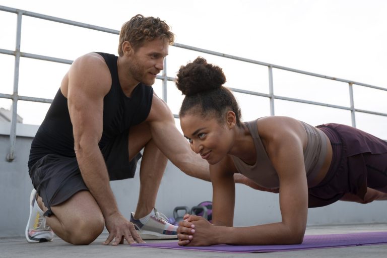 man and woman over 40 strength training outdoors to boost metabolism