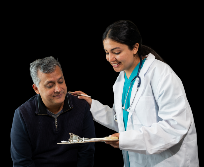 Middle-aged adult discussing wellness plan with healthcare provider